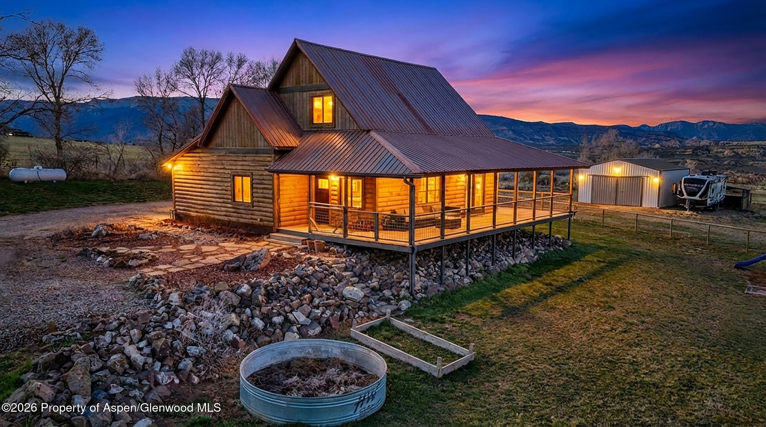 9109 County Road 320 Rifle, CO 81650 - Photo 32 of 38 a view of a backyard with a patio