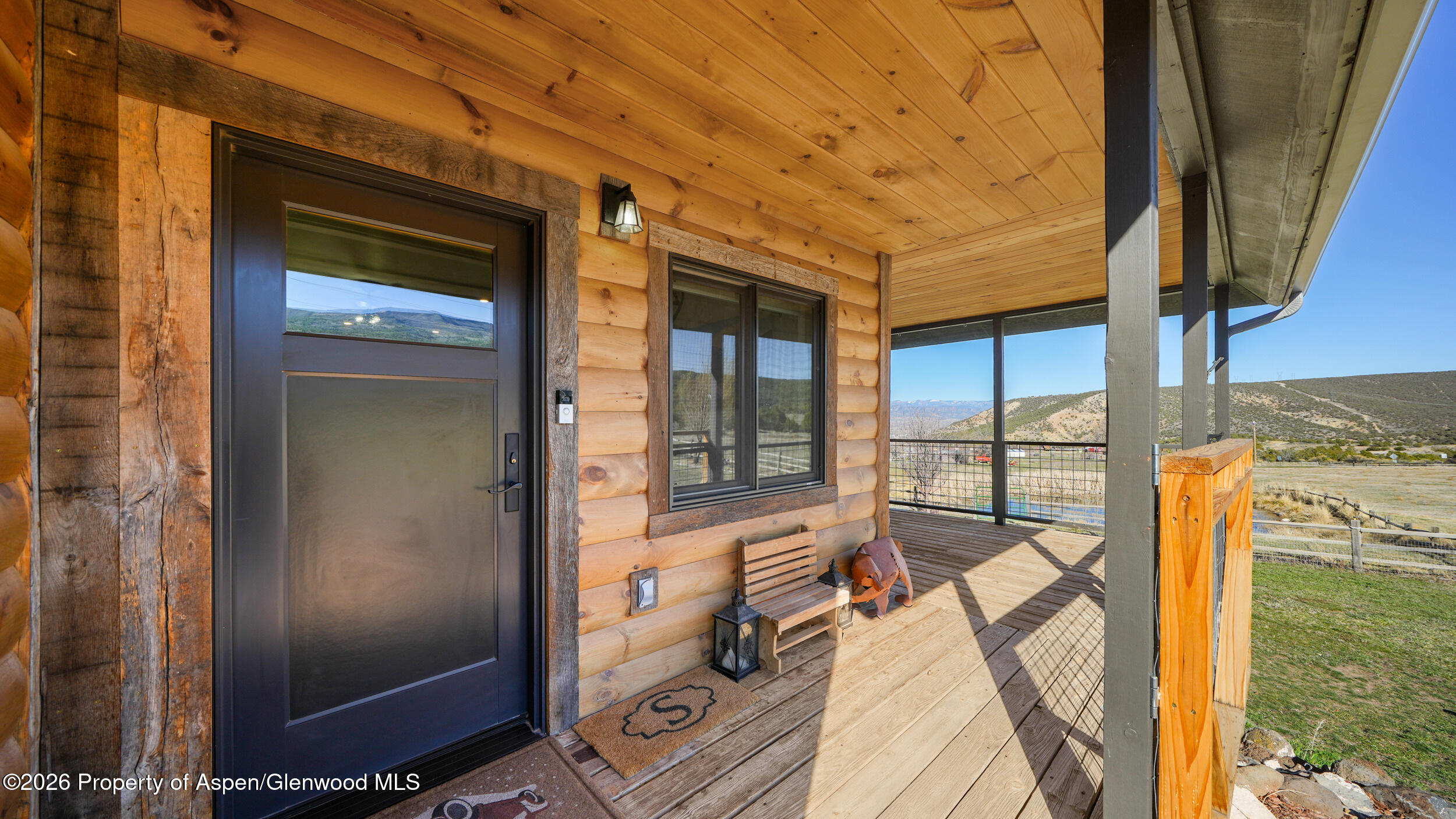 9109 County Road 320 Rifle, CO 81650 - Photo 7 of 38 a view of balcony with a floor to ceiling window and wooden floor