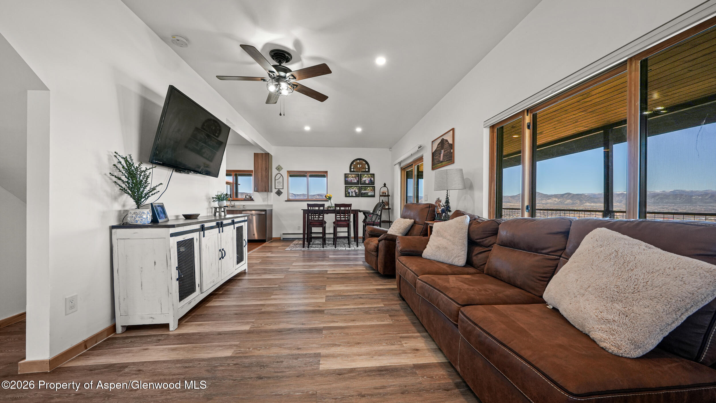 9109 County Road 320 Rifle, CO 81650 - Photo 8 of 38 a living room with furniture kitchen view and a large window
