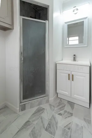 a bathroom with a sink and mirror