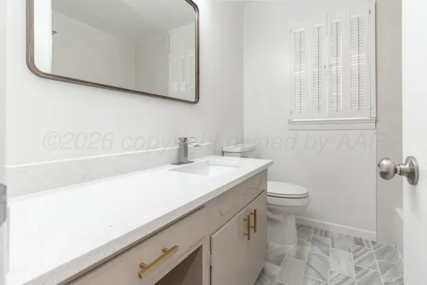 a bathroom with a sink and a toilet