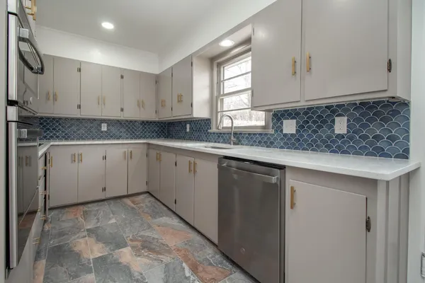 a view of a granite countertop cabinets
