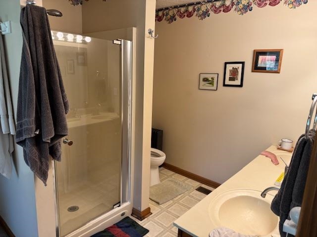 2551 Naylor Road Toone, TN 38381 - Photo 13 of 23 Full bathroom featuring vanity, a stall shower, and light flooring