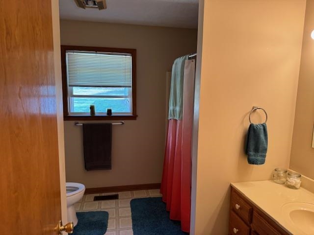 2551 Naylor Road Toone, TN 38381 - Photo 14 of 23 Bathroom featuring a shower with curtain, vanity, and light floors