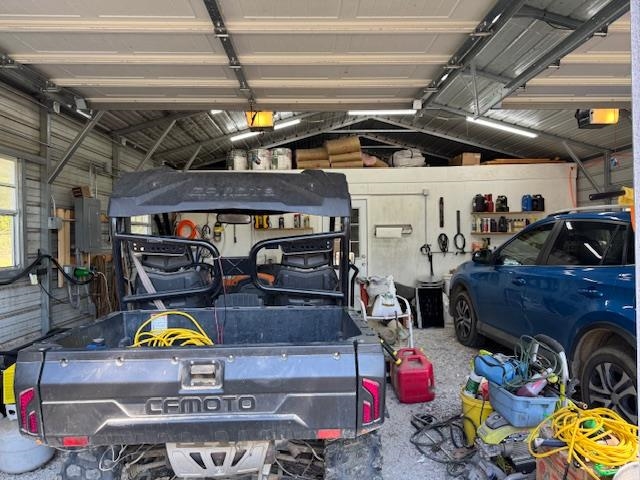 2551 Naylor Road Toone, TN 38381 - Photo 20 of 23 Garage featuring electric panel and a garage door opener