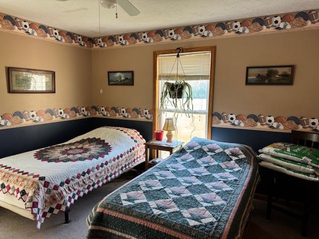 2551 Naylor Road Toone, TN 38381 - Photo 9 of 23 Bedroom with ceiling fan and dark colored carpet