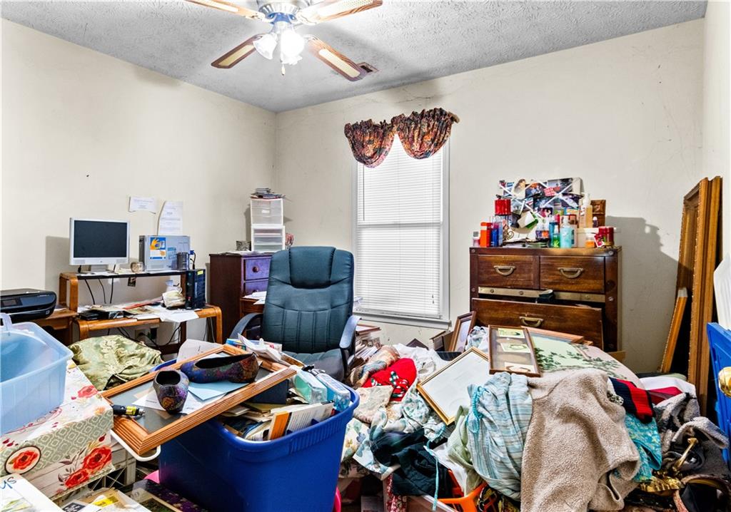 125 Laurel Way Covington, GA 30016 - Photo 18 of 21 a room with furniture and a flat screen tv