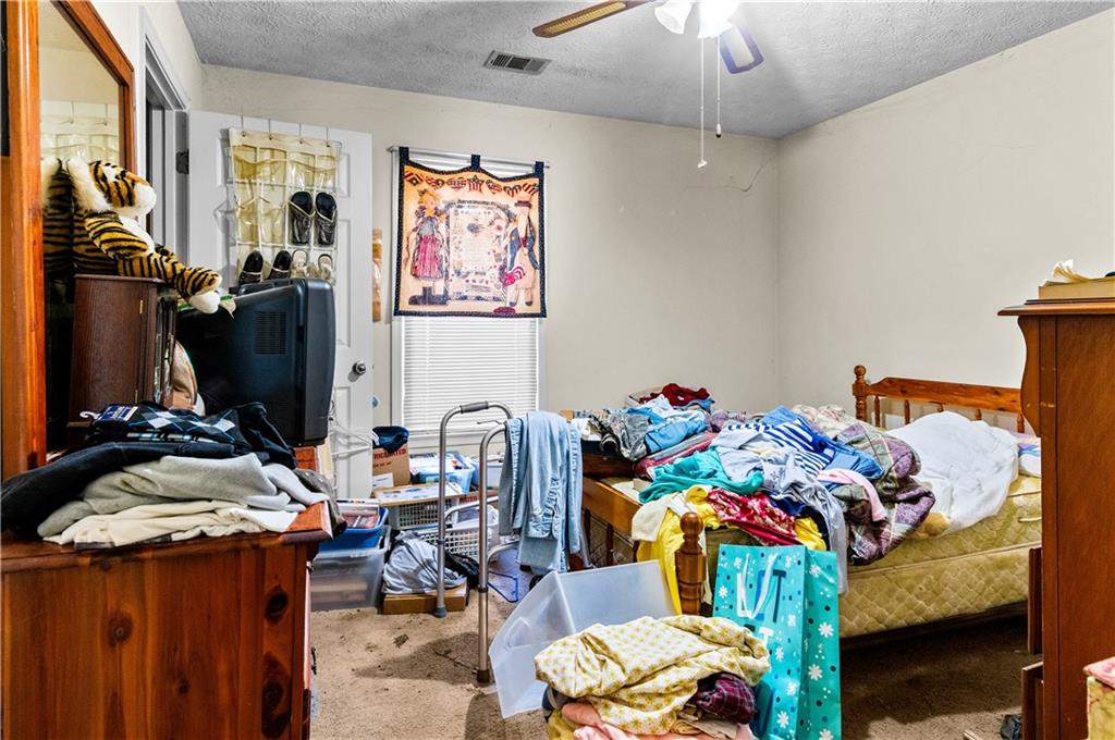 125 Laurel Way Covington, GA 30016 - Photo 19 of 21 a room with furniture toys and a chandelier