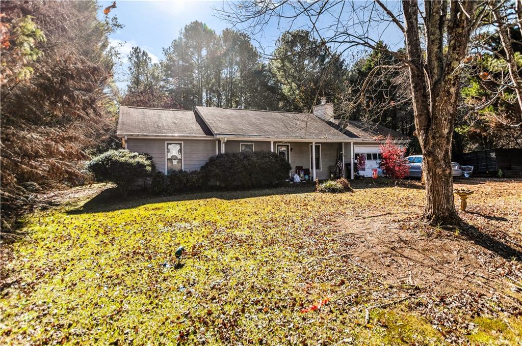 125 Laurel Way Covington, GA 30016 - Photo 3 of 21 a view of a house with a yard covered in snow
