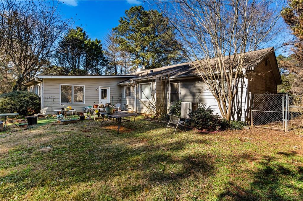 125 Laurel Way Covington, GA 30016 - Photo 4 of 21 a view of a house with a yard
