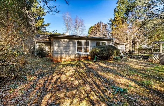 a view of a kitchen with refrigerator and a stove