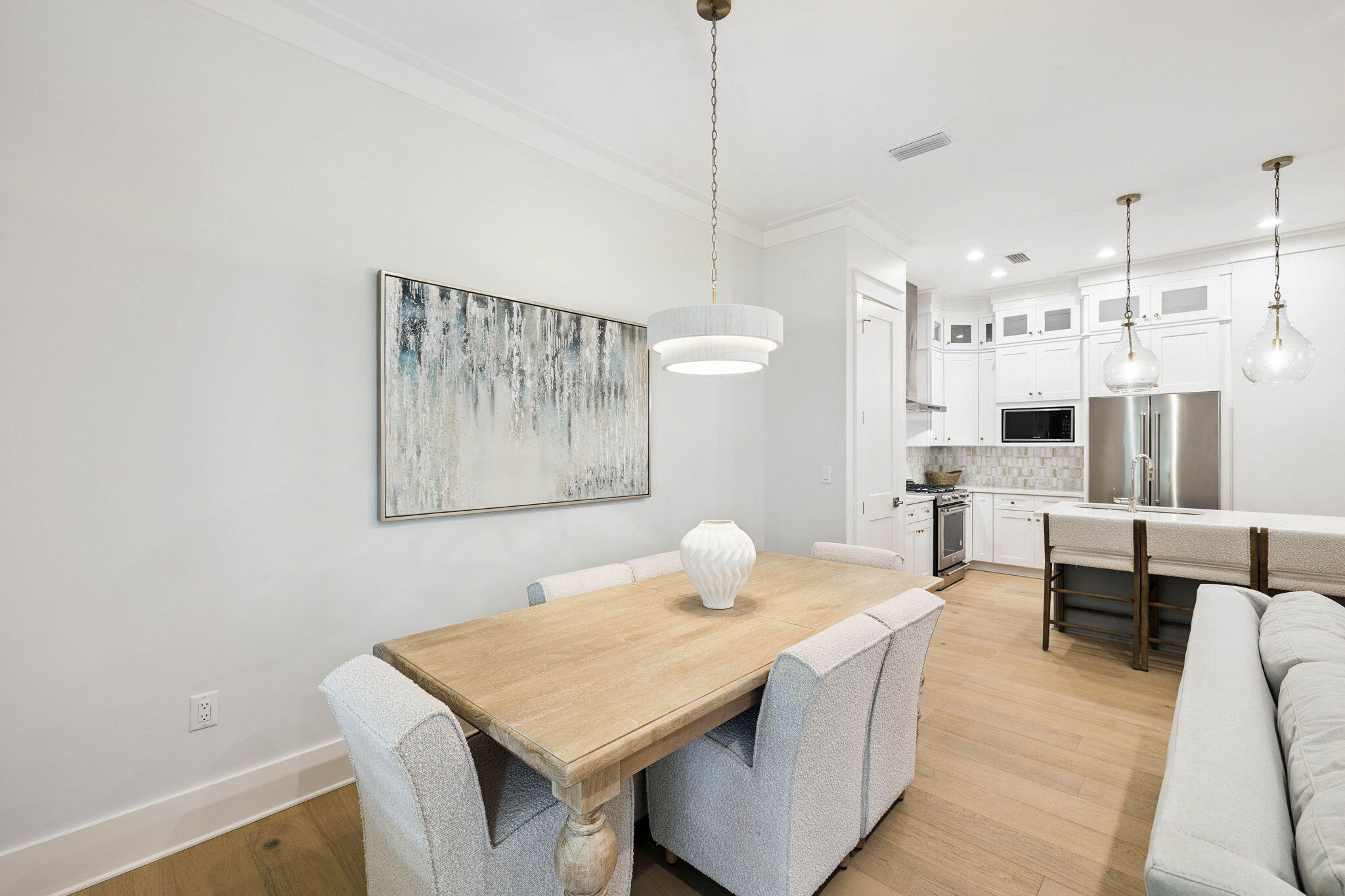 45 Grove Townhomes Place, Unit 101 Santa Rosa Beach, FL 32459 - Photo 15 of 36 a living room with stainless steel appliances furniture a rug and a kitchen view