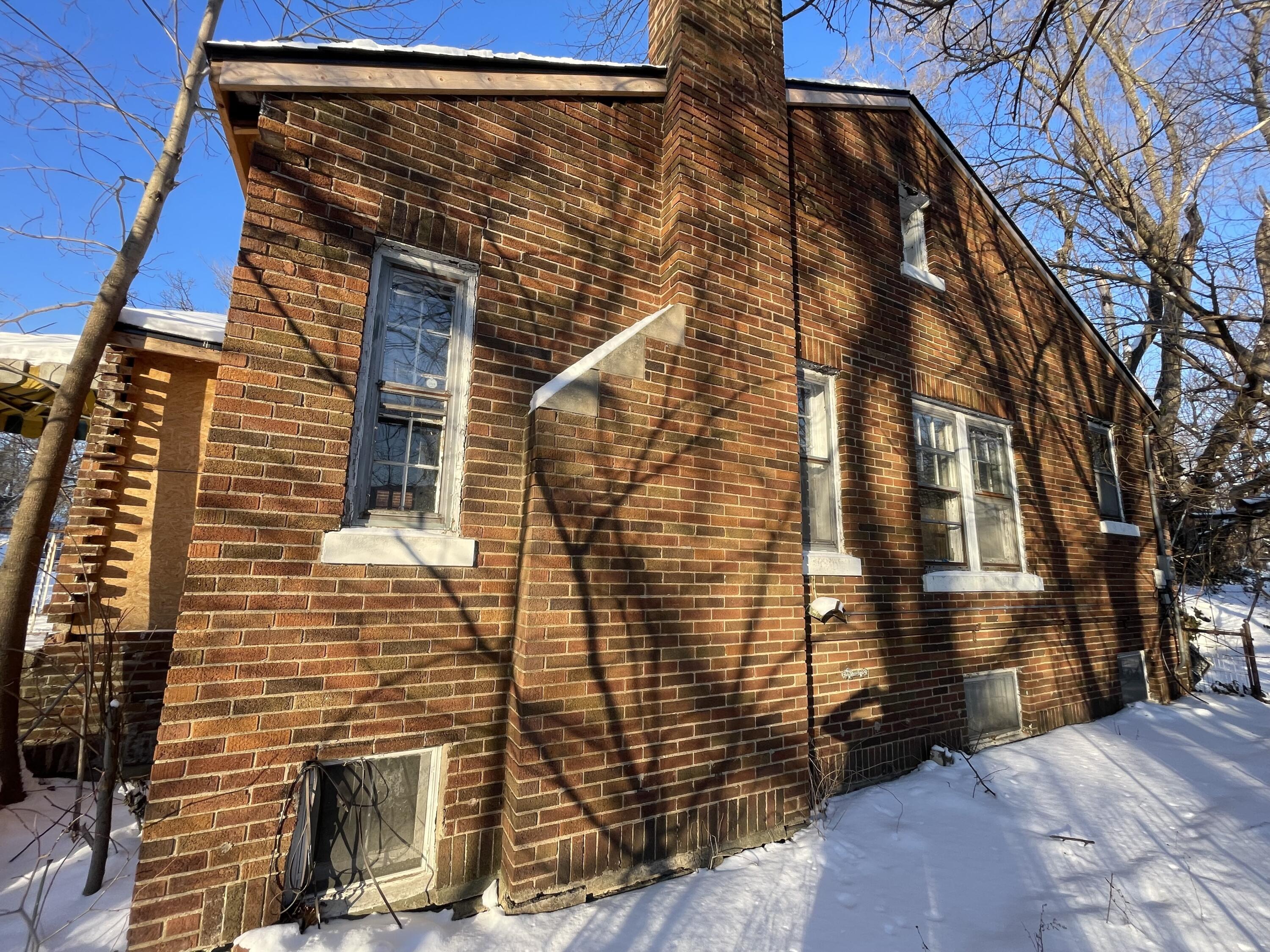 4169 Monroe Street Gary, IN 46408 - Photo 19 of 23 a view of a brick house with many windows