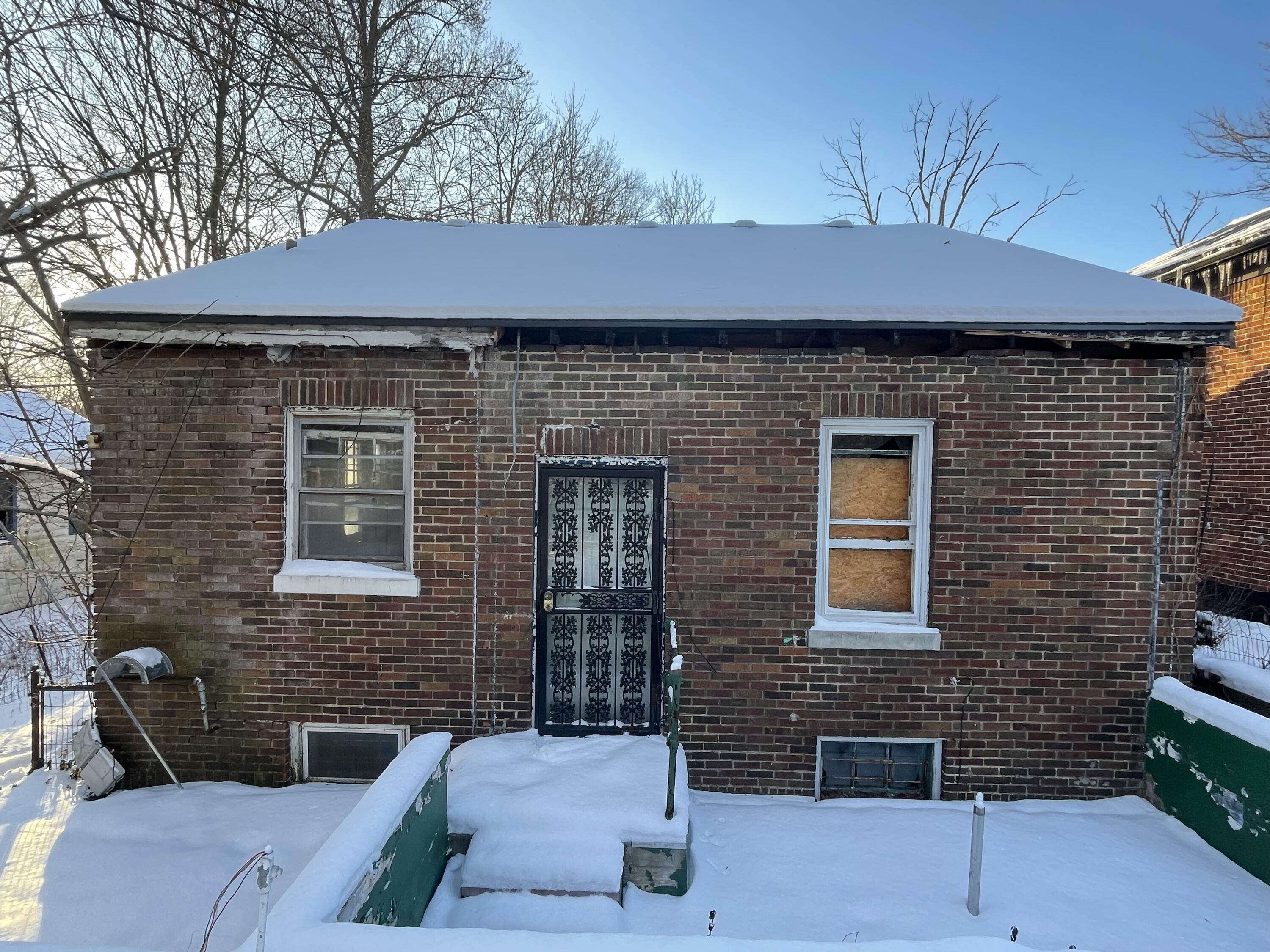 4169 Monroe Street Gary, IN 46408 - Photo 21 of 23 a front view of a house with a yard