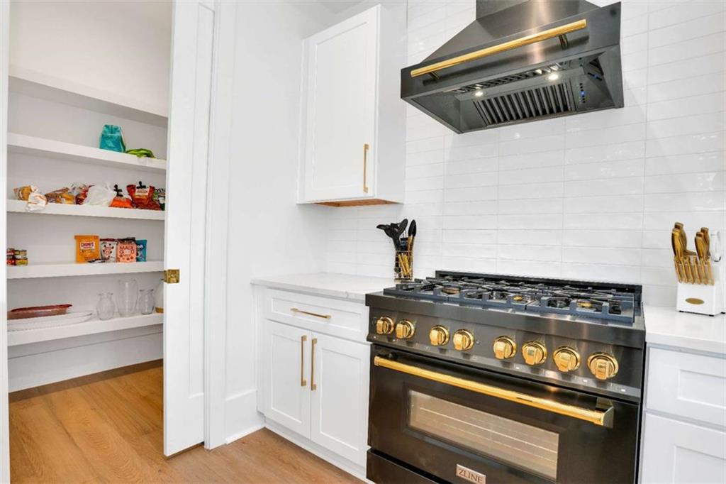 1598 Athens Avenue Southwest Atlanta, GA 30310 - Photo 11 of 45 a stove top oven sitting inside of a kitchen