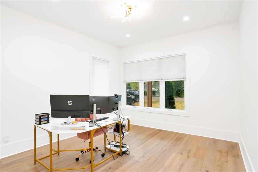 1598 Athens Avenue Southwest Atlanta, GA 30310 - Photo 18 of 45 a view of a workspace with furniture and a window