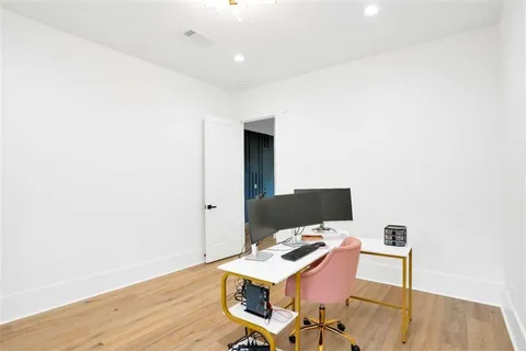 a bathroom with a sink a bathtub and a mirror