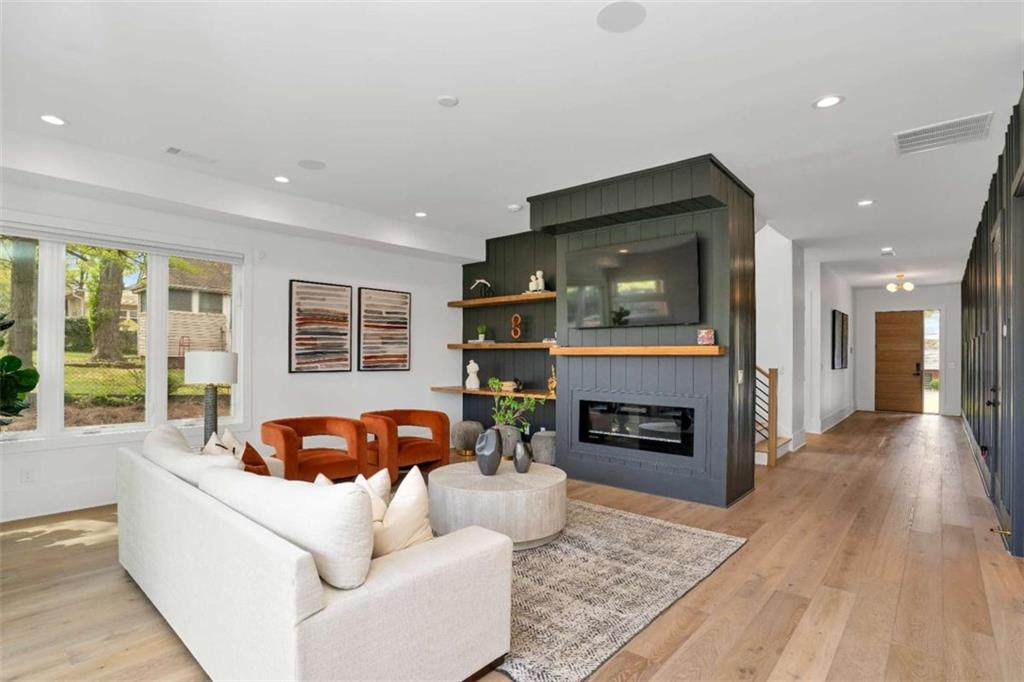 1598 Athens Avenue Southwest Atlanta, GA 30310 - Photo 22 of 45 a living room with furniture and a fireplace
