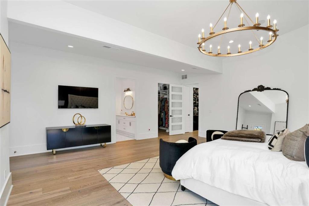 1598 Athens Avenue Southwest Atlanta, GA 30310 - Photo 31 of 45 a bedroom with a bed and a flat screen tv