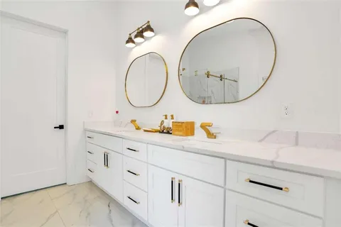 a bathroom with a tub and shower