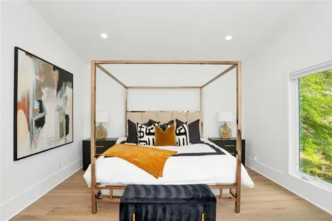 a bedroom with furniture and a window