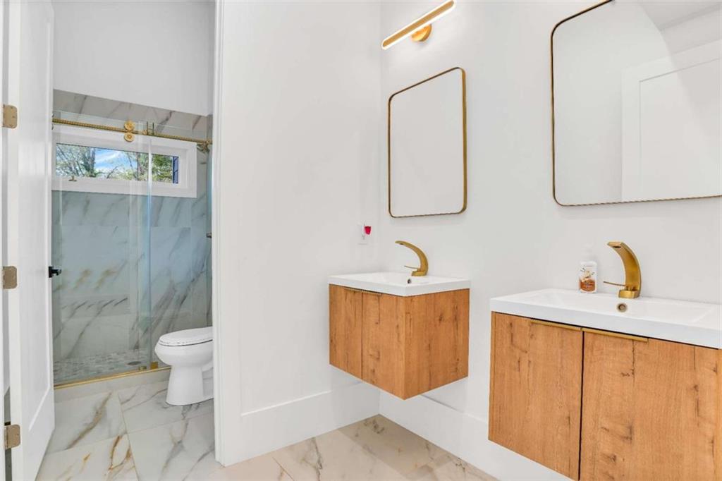 1598 Athens Avenue Southwest Atlanta, GA 30310 - Photo 38 of 45 a bathroom with a sink a toilet and shower