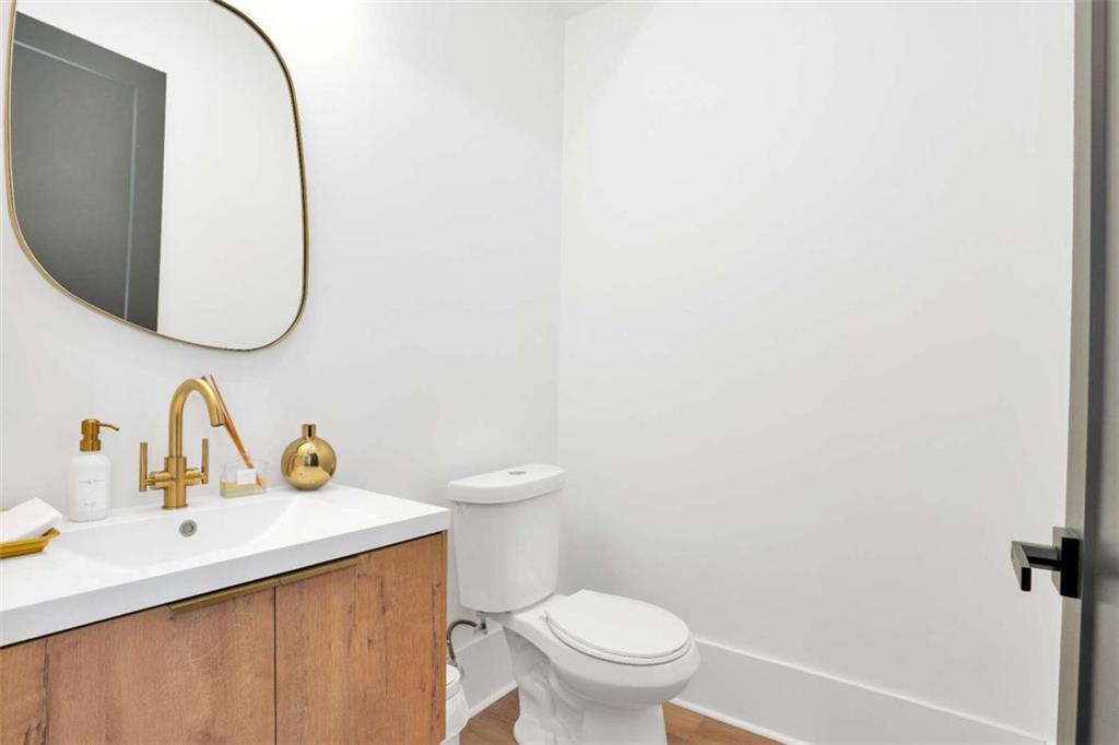 1598 Athens Avenue Southwest Atlanta, GA 30310 - Photo 5 of 45 a bathroom with a toilet sink and mirror