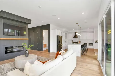 a living room with furniture and a table