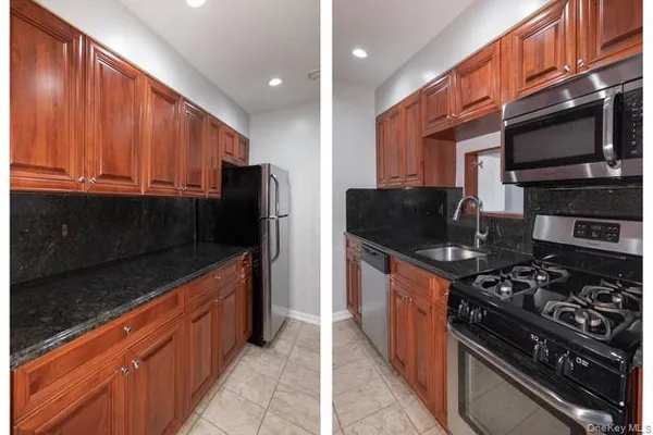 a kitchen with stainless steel appliances granite countertop a stove and a refrigerator