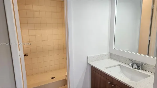 a bathroom with a shower and a toilet