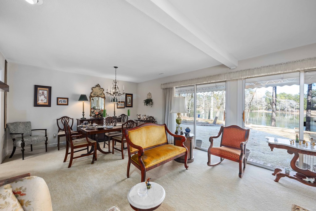 13965 Cross Creek Road Upatoi, GA 31829 - Photo 11 of 44 a living room with furniture and a large window