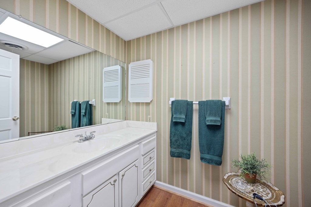 13965 Cross Creek Road Upatoi, GA 31829 - Photo 13 of 44 a bathroom with a sink and a mirror