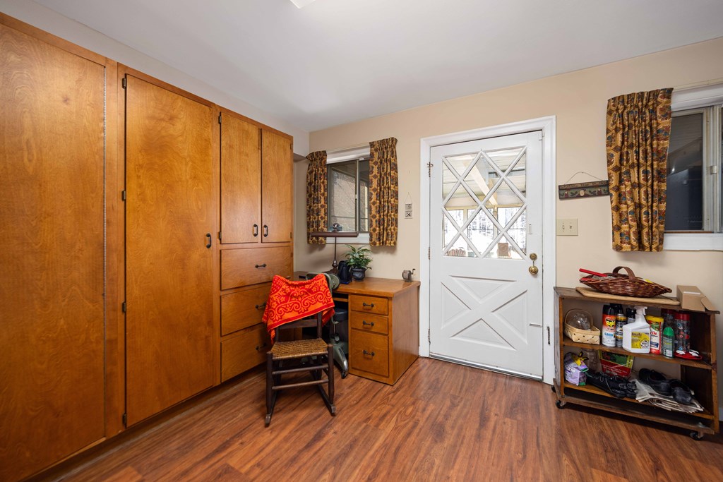 13965 Cross Creek Road Upatoi, GA 31829 - Photo 22 of 44 a view of a workspace with furniture and wooden floor