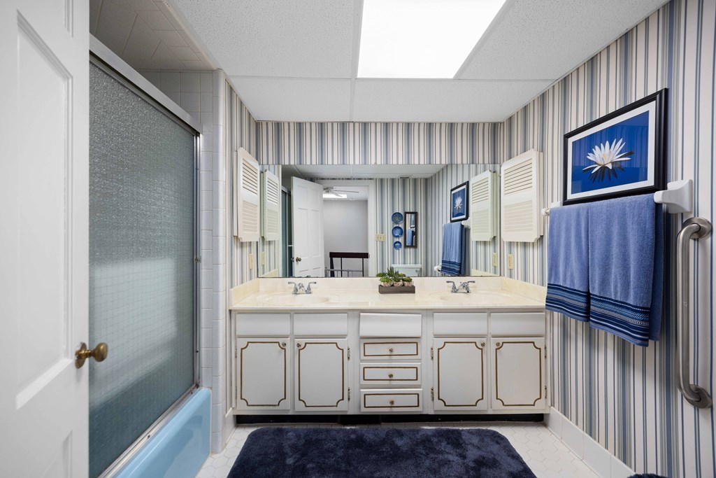 13965 Cross Creek Road Upatoi, GA 31829 - Photo 32 of 44 a bathroom with a sink a vanity and a mirror