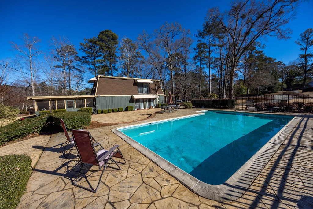 13965 Cross Creek Road Upatoi, GA 31829 - Photo 8 of 44 a view of a swimming pool with a patio