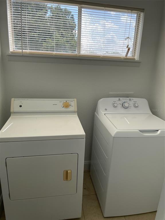 3994 Crayrich Circle, Unit C4 Orlando, FL 32839 - Photo 12 of 14 a utility room with dryer and washer