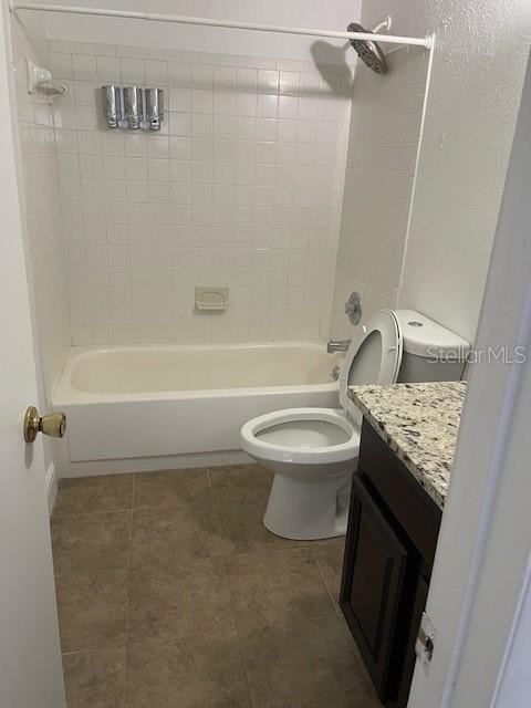 3994 Crayrich Circle, Unit C4 Orlando, FL 32839 - Photo 4 of 14 a bathroom with a granite countertop sink toilet and shower