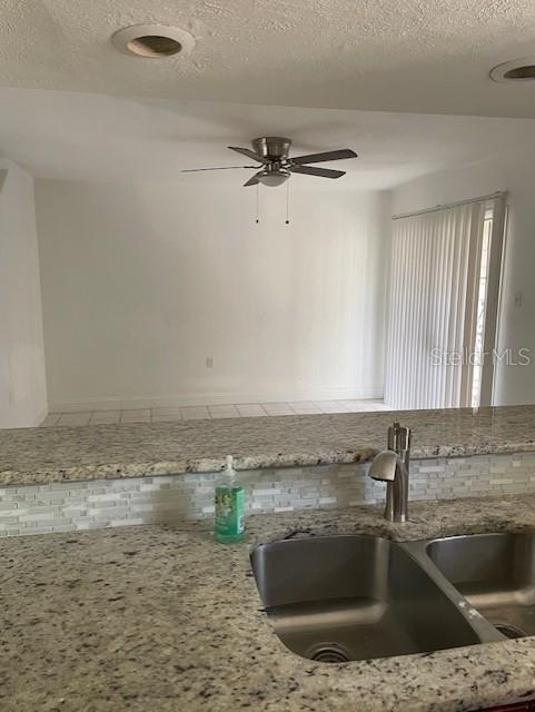 3994 Crayrich Circle, Unit C4 Orlando, FL 32839 - Photo 8 of 14 a kitchen with a sink cabinets and a granite counter top