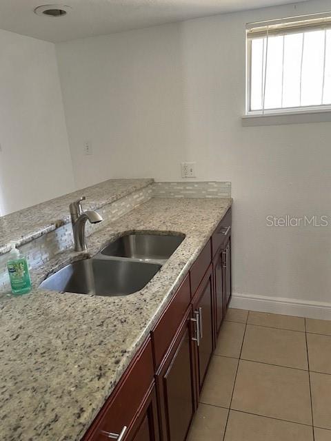 3994 Crayrich Circle, Unit C4 Orlando, FL 32839 - Photo 10 of 14 a kitchen with a sink and cabinets