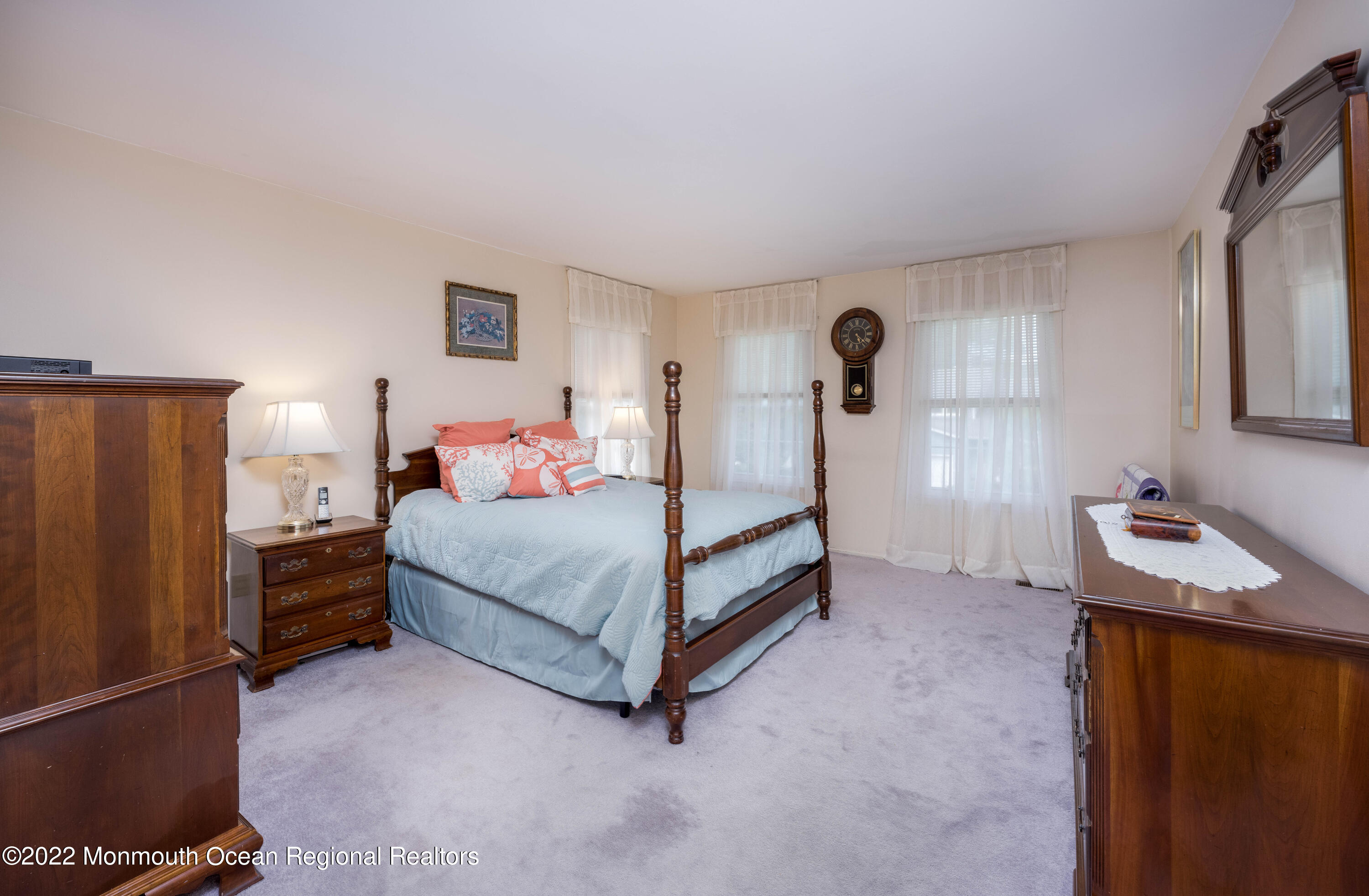 9 Metedeconk Road Howell, NJ 07731 - Photo 19 of 25 a bedroom with a bed and a cabinets