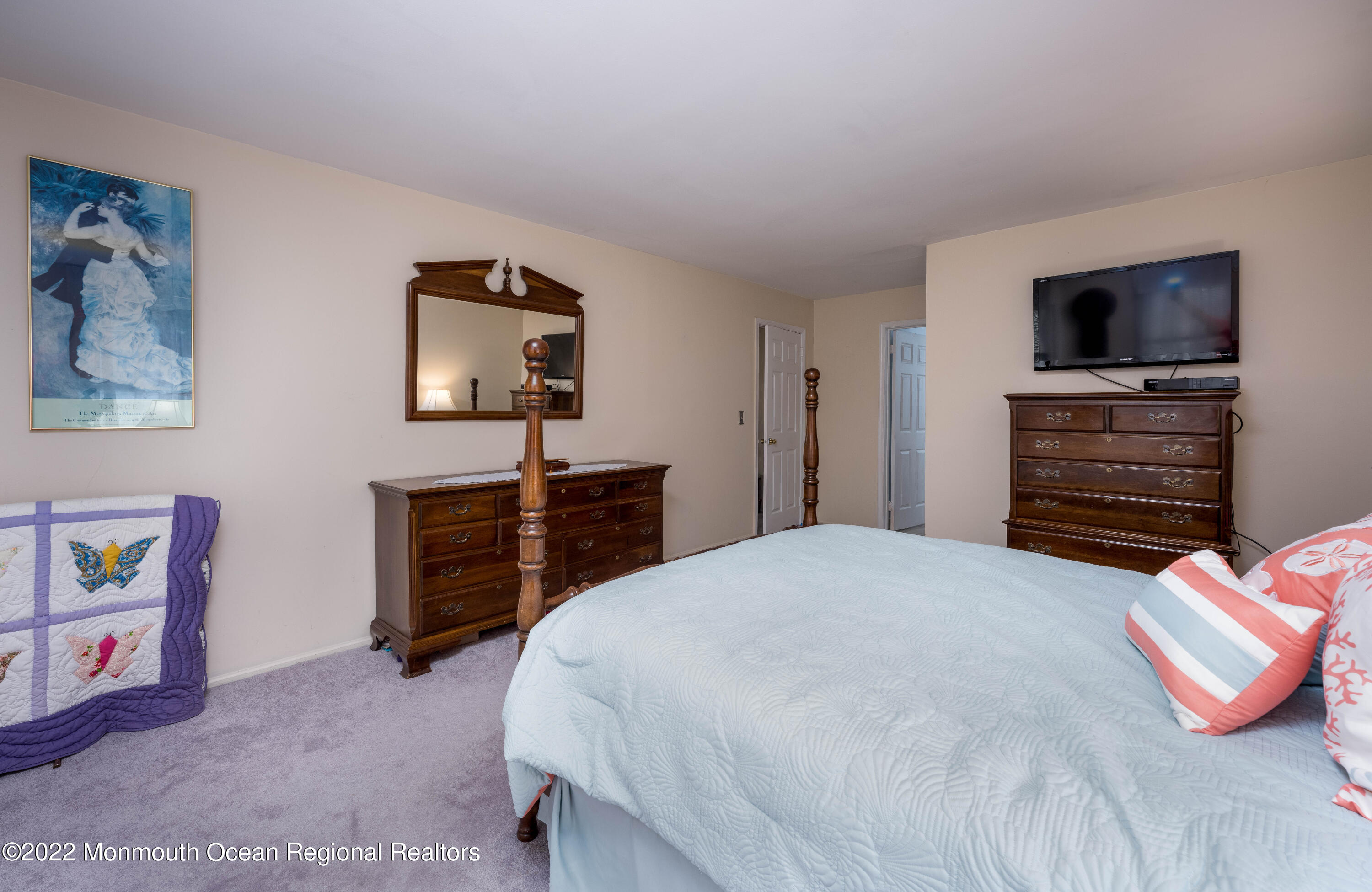 9 Metedeconk Road Howell, NJ 07731 - Photo 21 of 25 a bedroom with a bed and a television