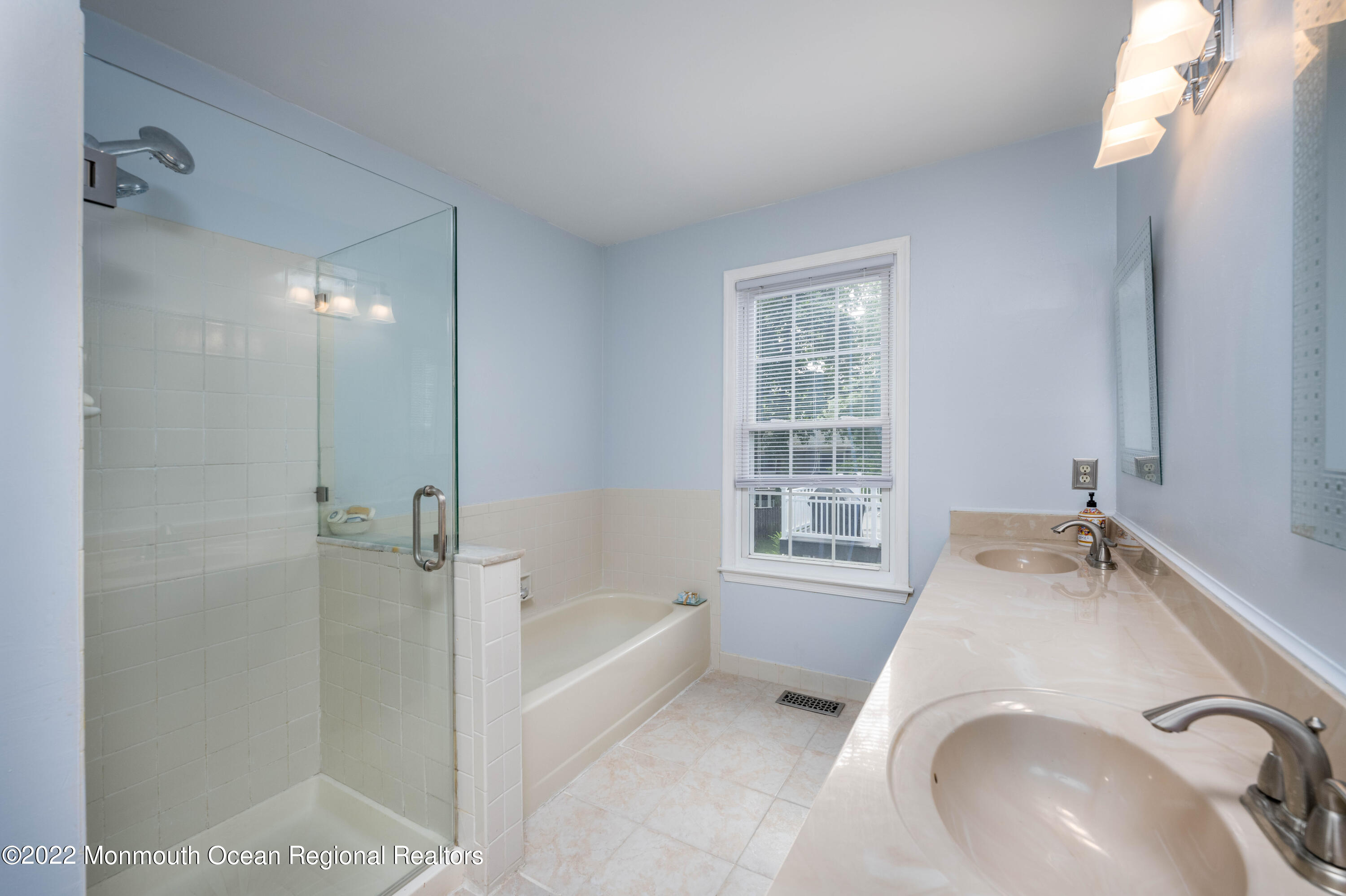 9 Metedeconk Road Howell, NJ 07731 - Photo 23 of 25 a bathroom with a tub sink and mirror