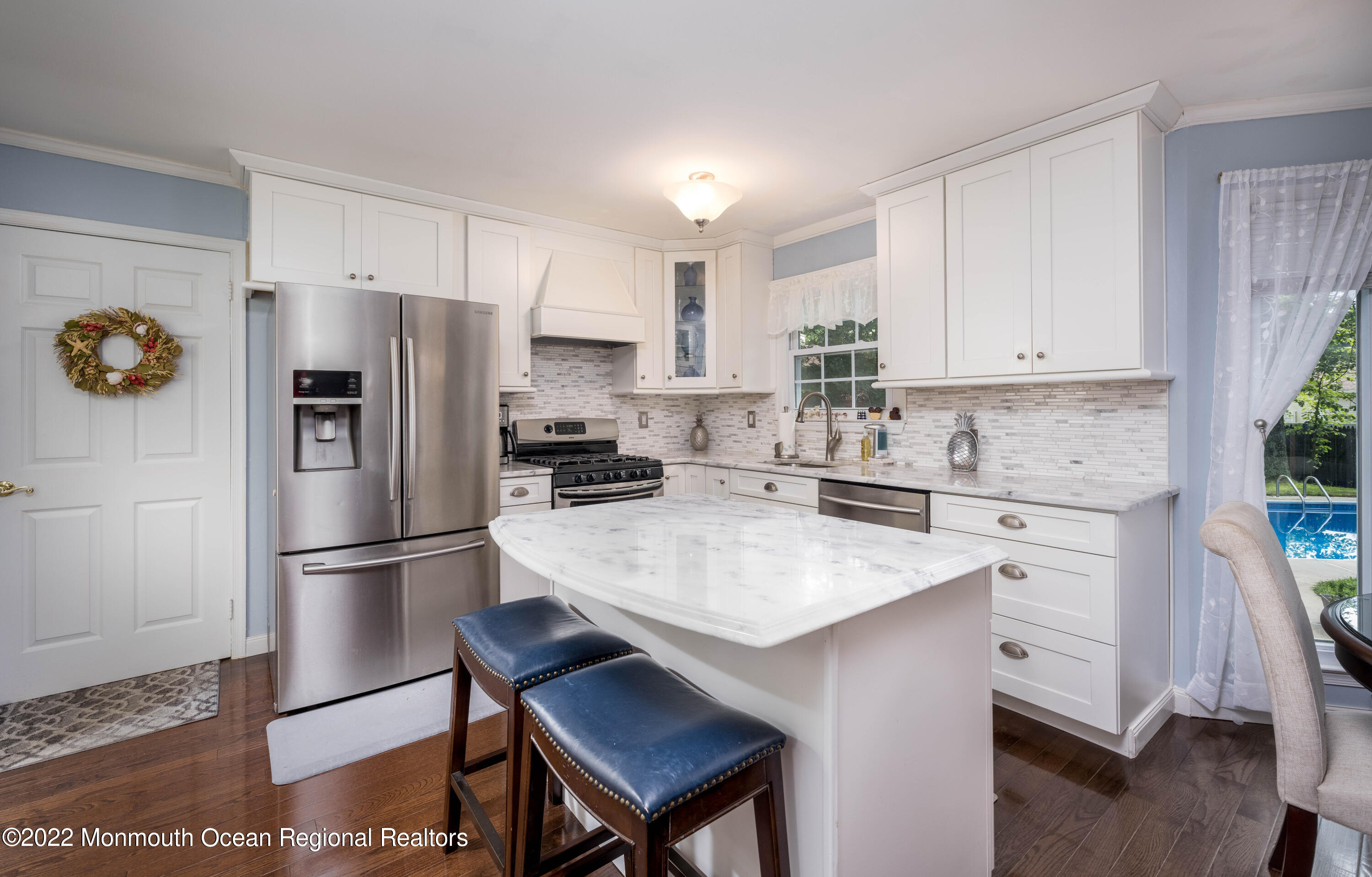 9 Metedeconk Road Howell, NJ 07731 - Photo 4 of 25 a kitchen with stainless steel appliances a refrigerator sink and cabinets