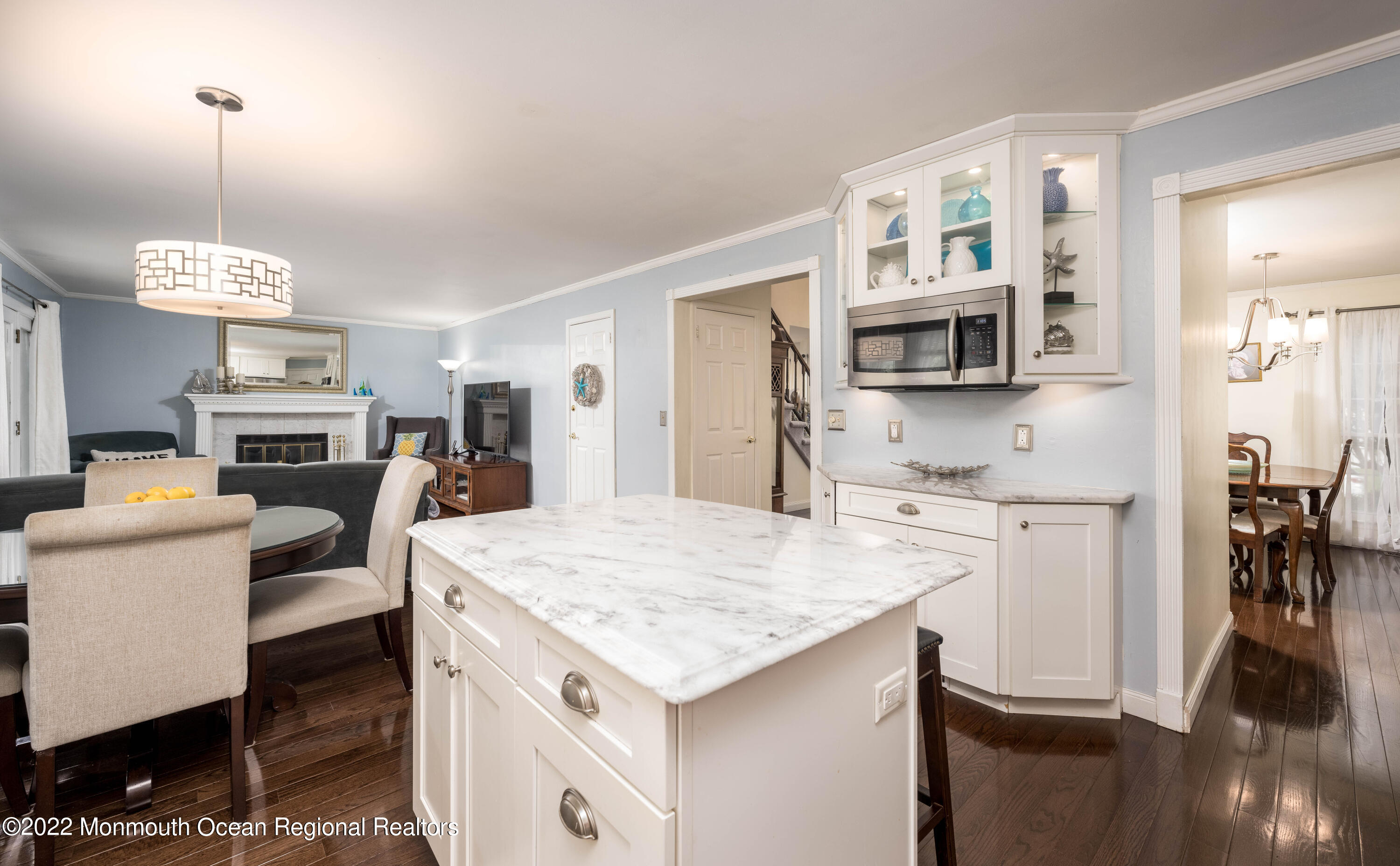9 Metedeconk Road Howell, NJ 07731 - Photo 5 of 25 a kitchen that has a lot of cabinets a sink and a wooden floor