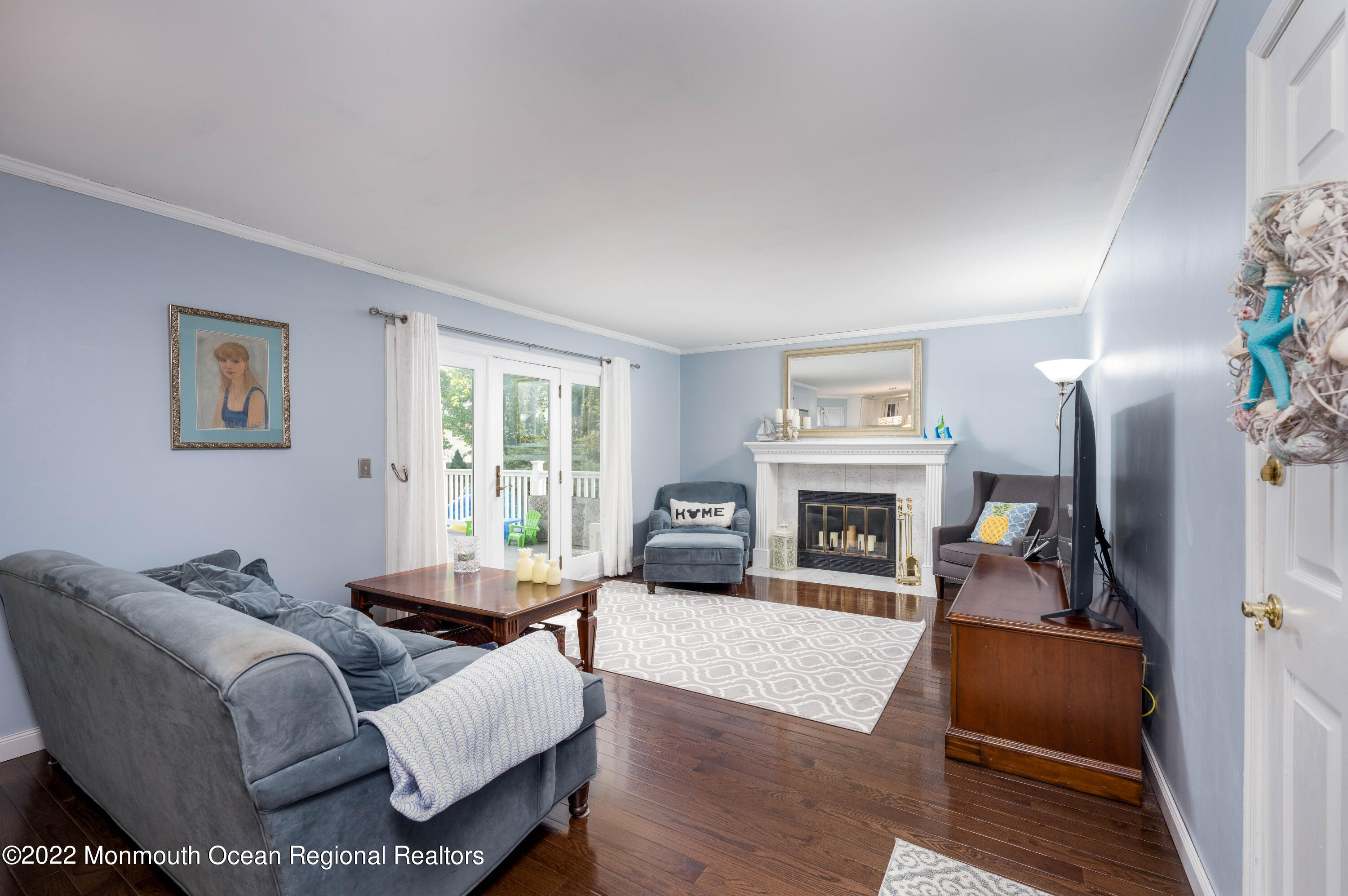 9 Metedeconk Road Howell, NJ 07731 - Photo 6 of 25 a living room with furniture and a fireplace