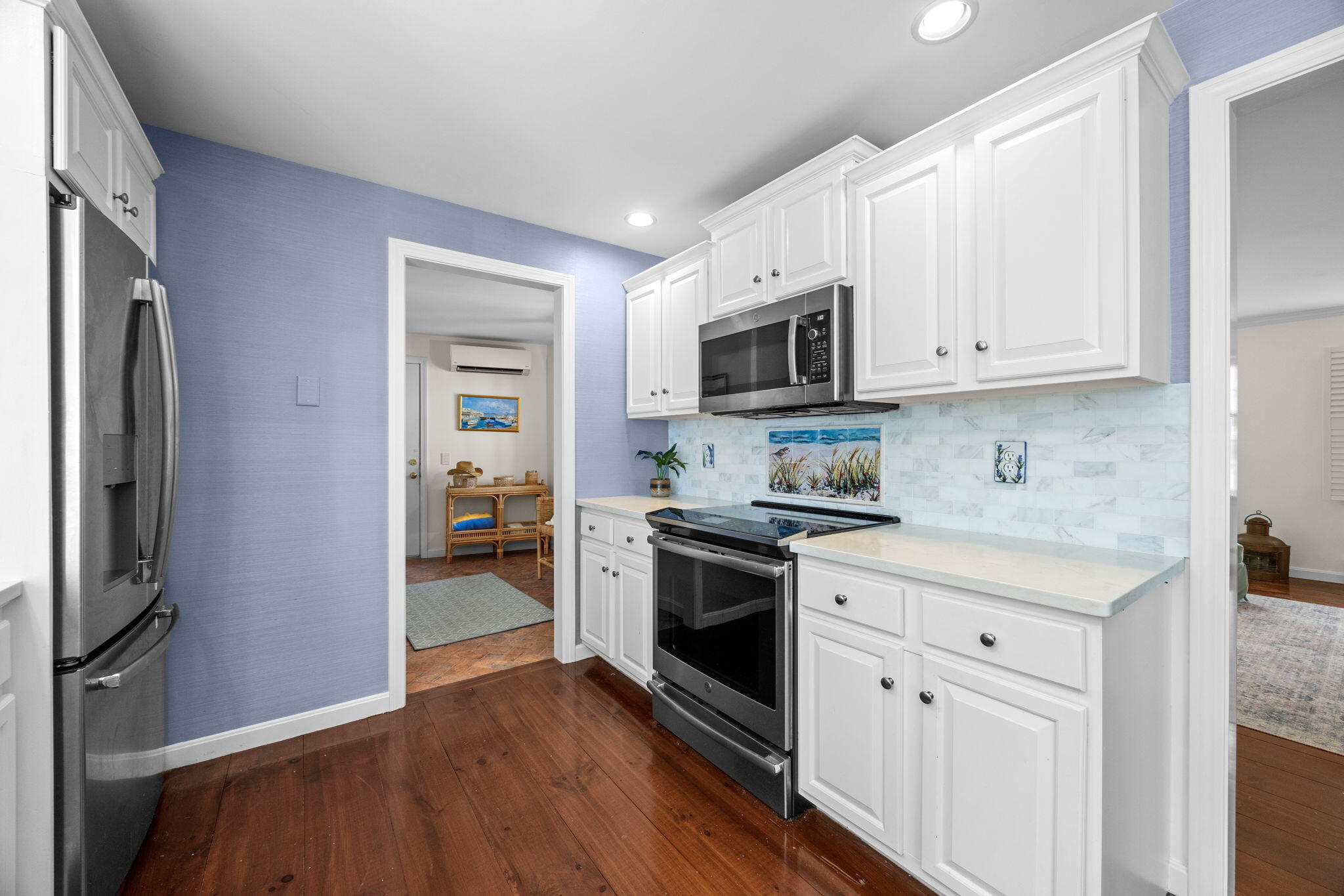 17 Cres Ridge Way Orleans, MA 02653 - Photo 14 of 47 a kitchen with stainless steel appliances white cabinets and wooden floor