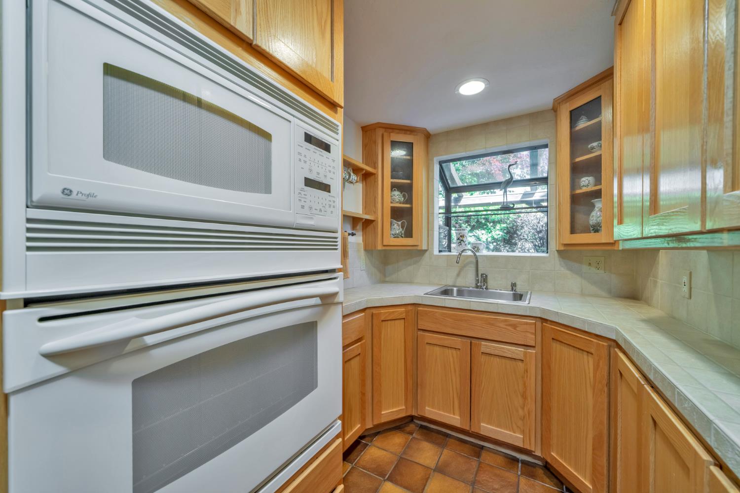 2399 Kingsgate Road Placerville, CA 95667 - Photo 24 of 89 a kitchen with a sink and cabinets