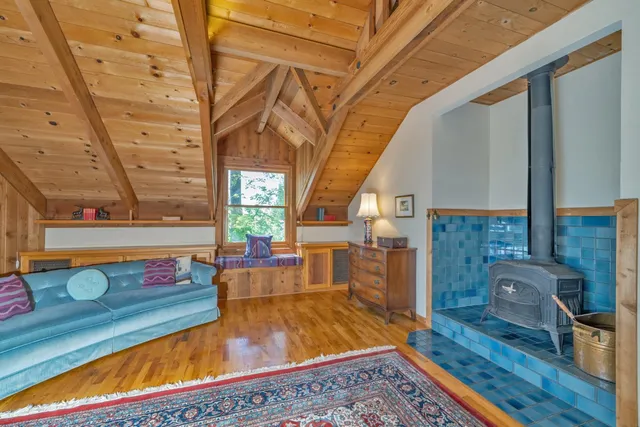 a spacious bedroom with a bed and glass door