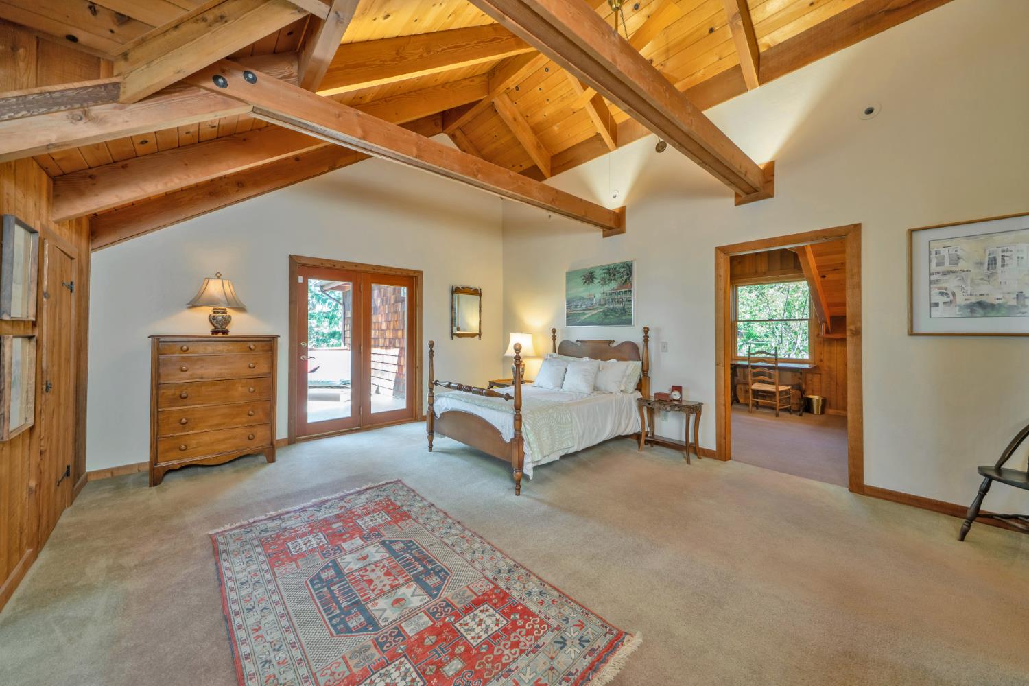 2399 Kingsgate Road Placerville, CA 95667 - Photo 37 of 89 a spacious bedroom with a bed and a chandelier