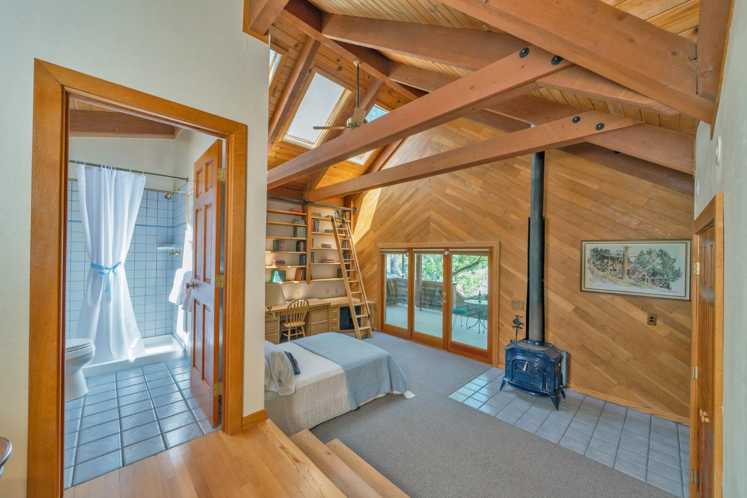 2399 Kingsgate Road Placerville, CA 95667 - Photo 45 of 89 a spacious bedroom with a bed and glass door